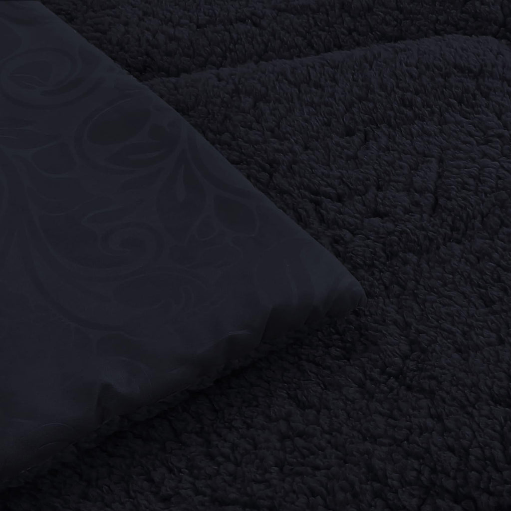 Detalle microfibra embossed y sherpa negro Martiné Sonya